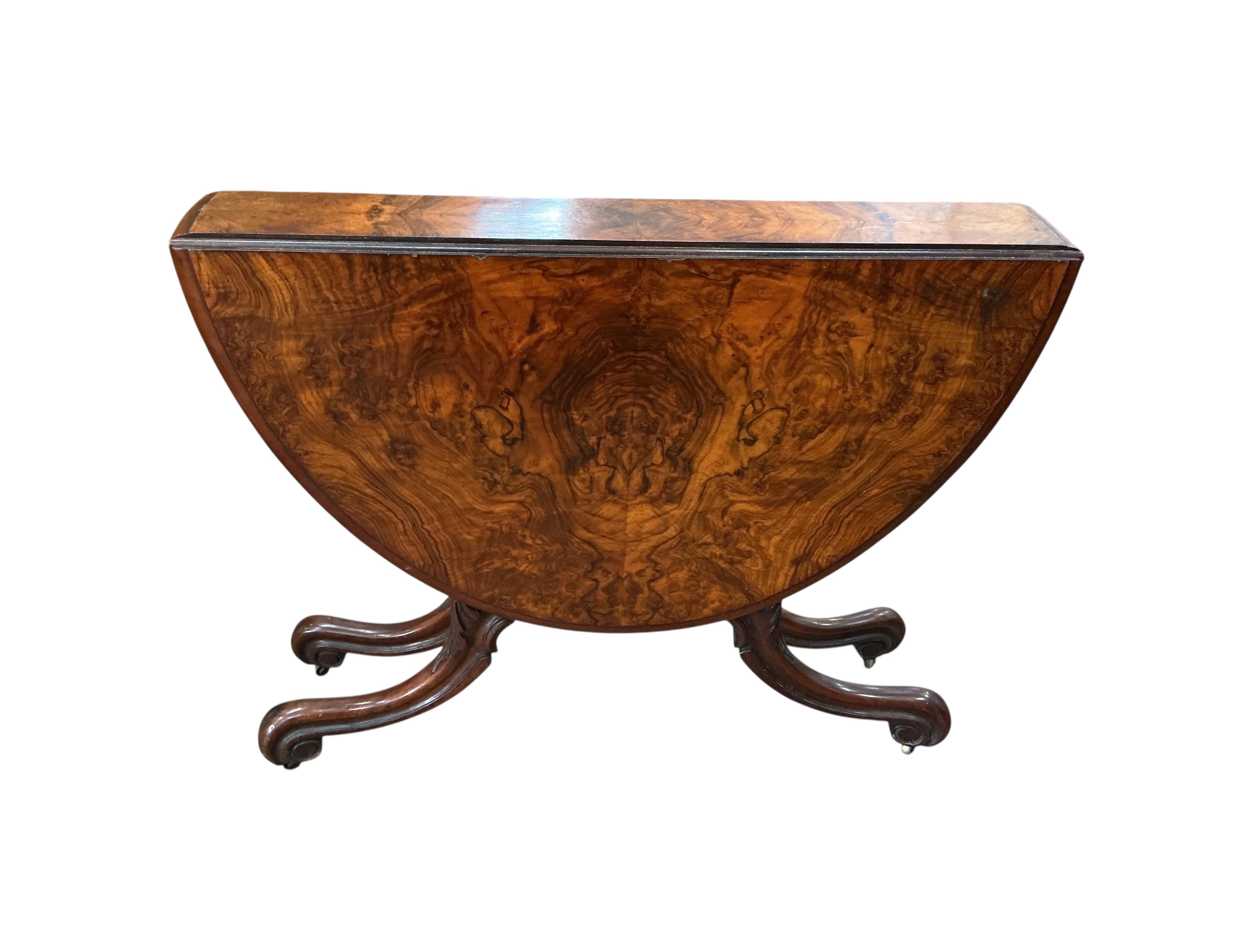 A Victorian burr walnut Sutherland table, width 91cm, height 73cm